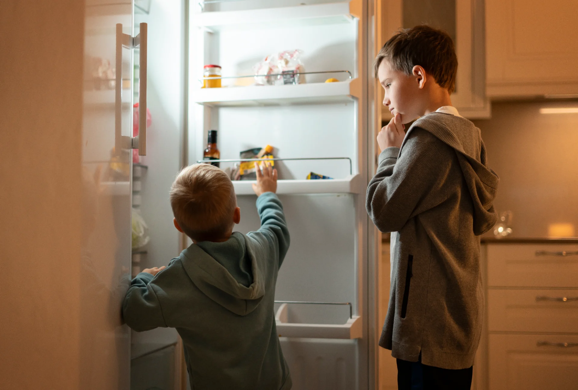 kids looking at the fridge